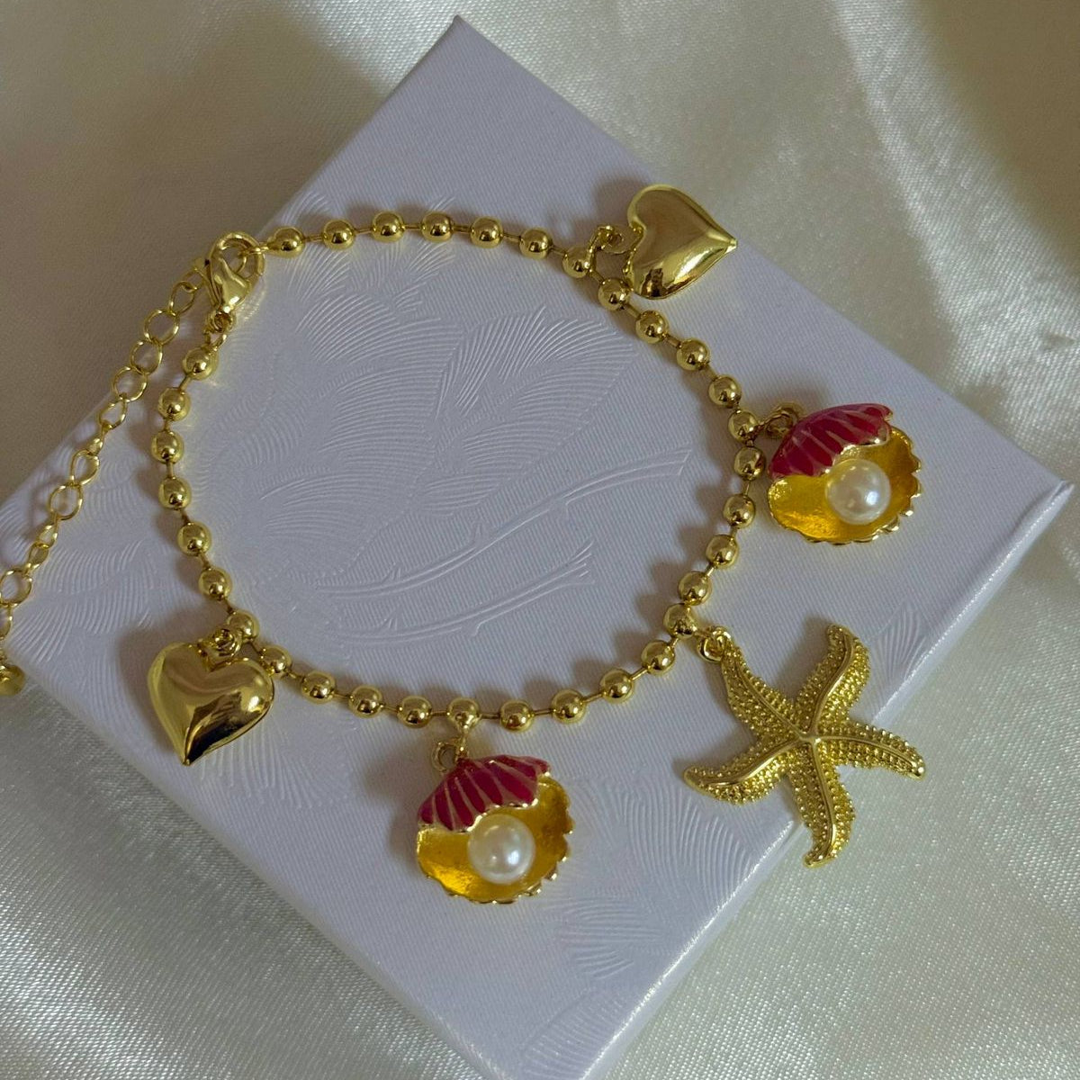 Pulseras playeras material oro Golfield