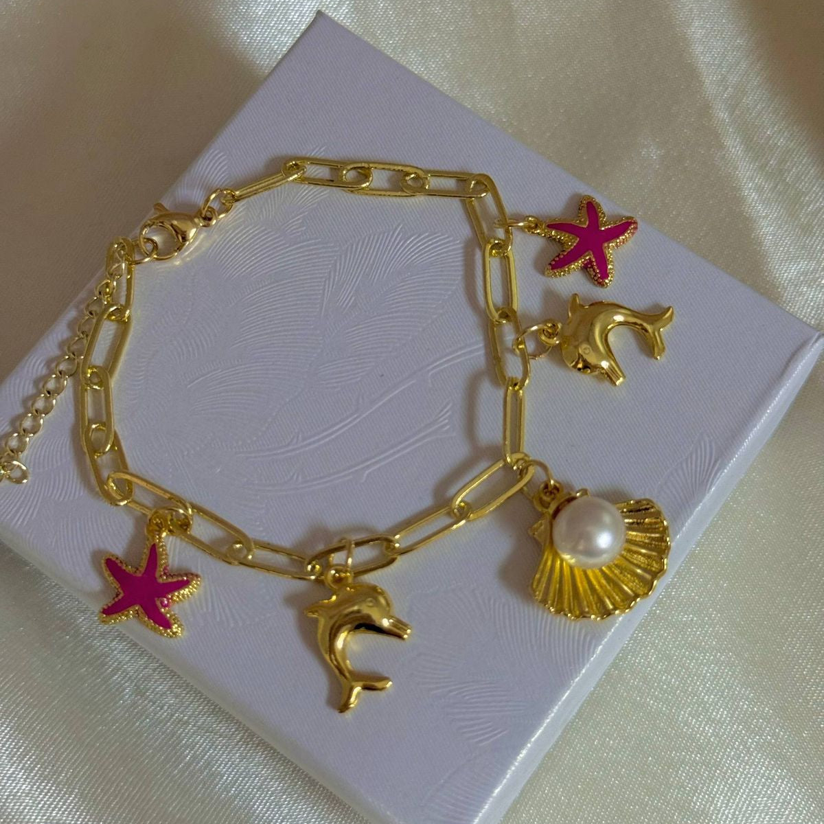 Pulseras playeras material oro Golfield