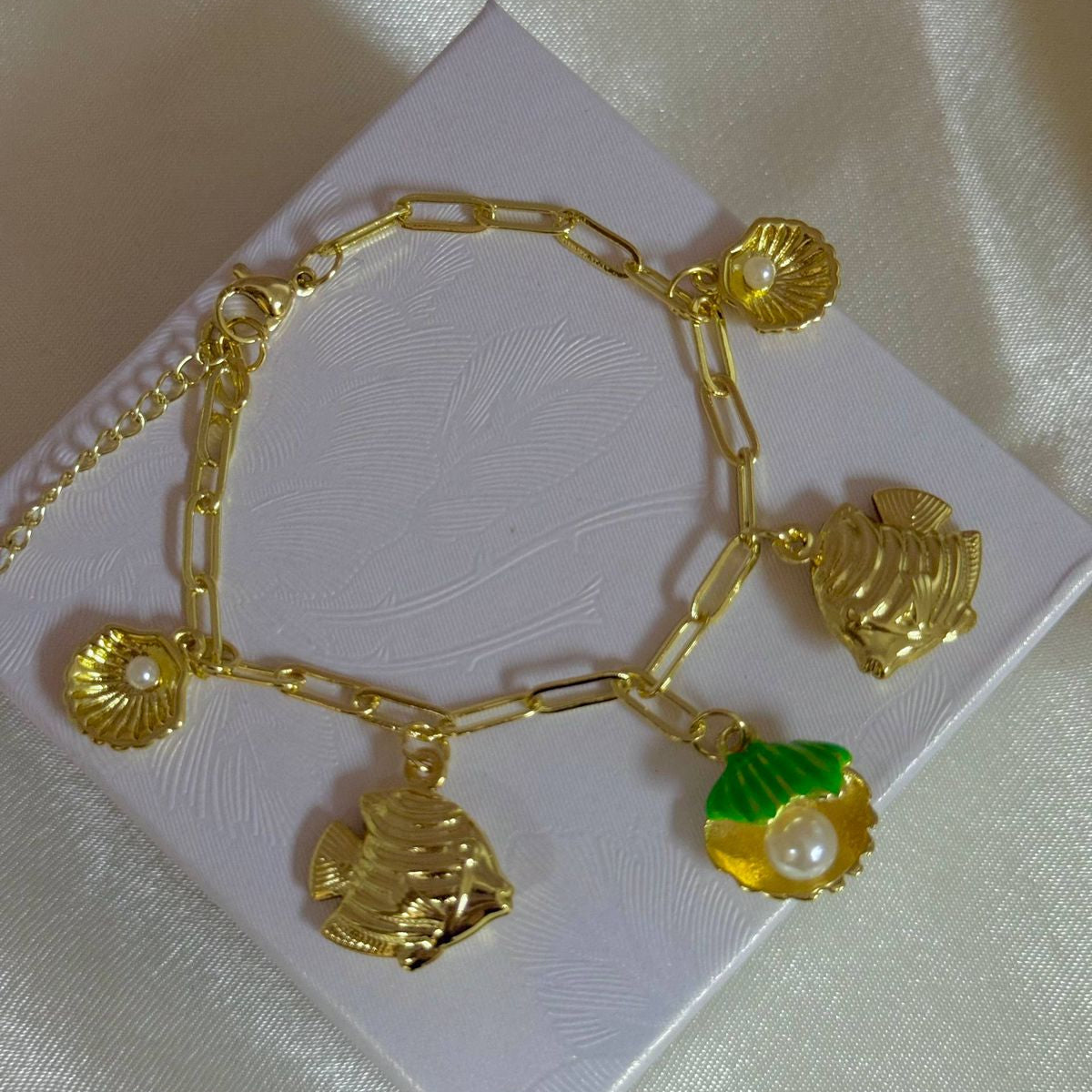 Pulseras playeras material oro Golfield