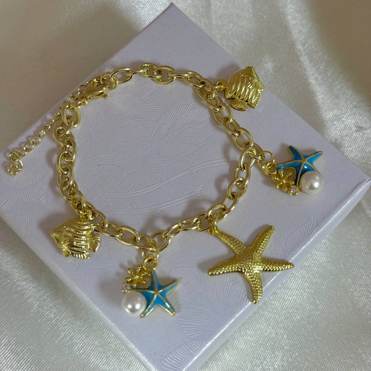 Pulseras playeras material oro Golfield